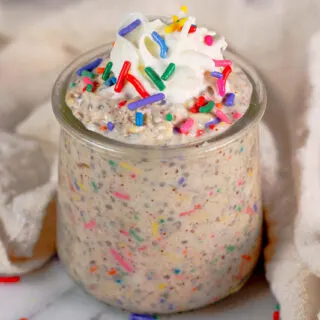 a glass cup of birthday cake overnight oats