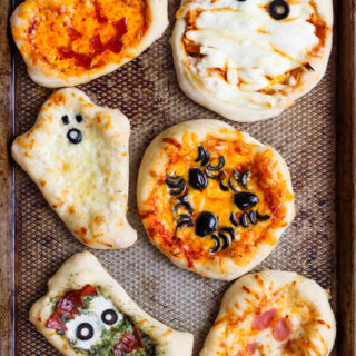 mini halloween pizzas on a tray